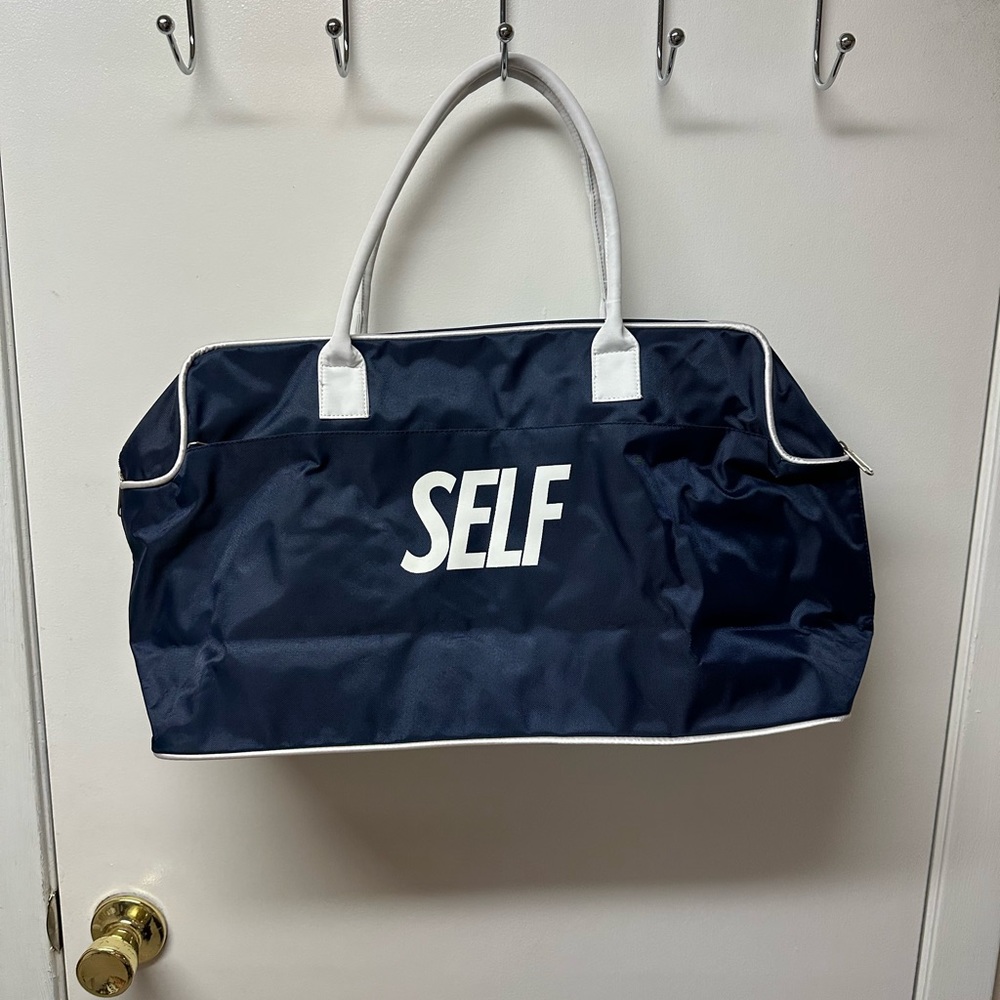 Brand new navy blue with white trim tote bag. Pet and smoke free home.